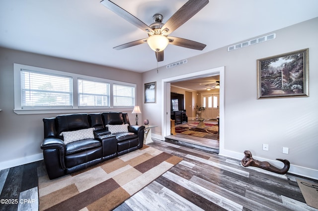 living room with hardwood / wood-style floors and ceiling fan