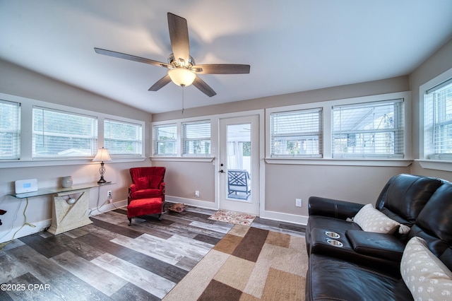 sitting room with ceiling fan and dark hardwood / wood-style floors