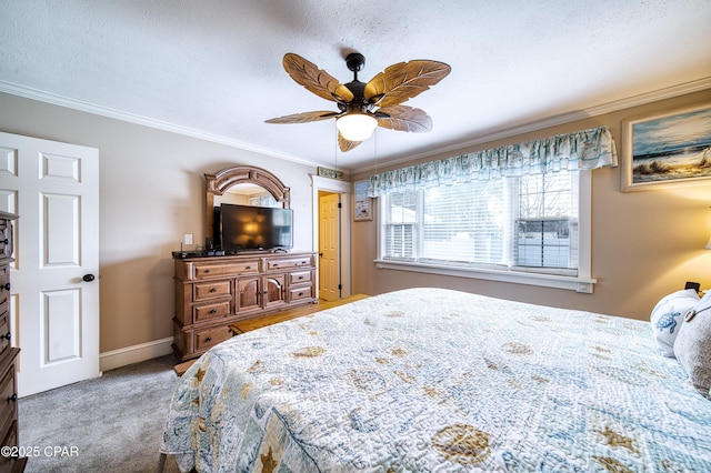 carpeted bedroom with crown molding, ceiling fan, and a textured ceiling