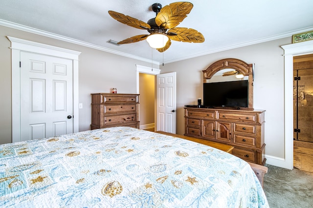 bedroom featuring crown molding, carpet floors, ensuite bathroom, and ceiling fan