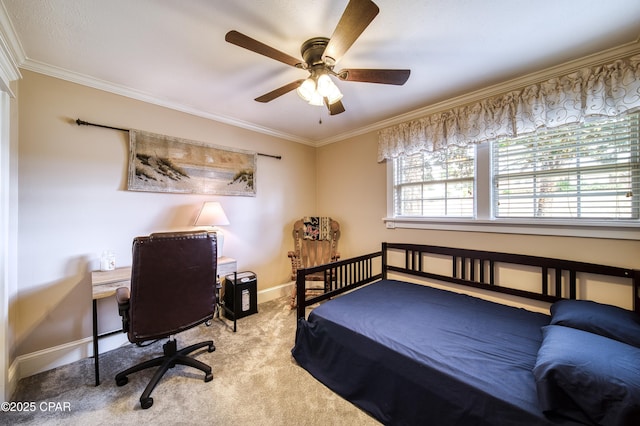 bedroom featuring crown molding, light colored carpet, and ceiling fan