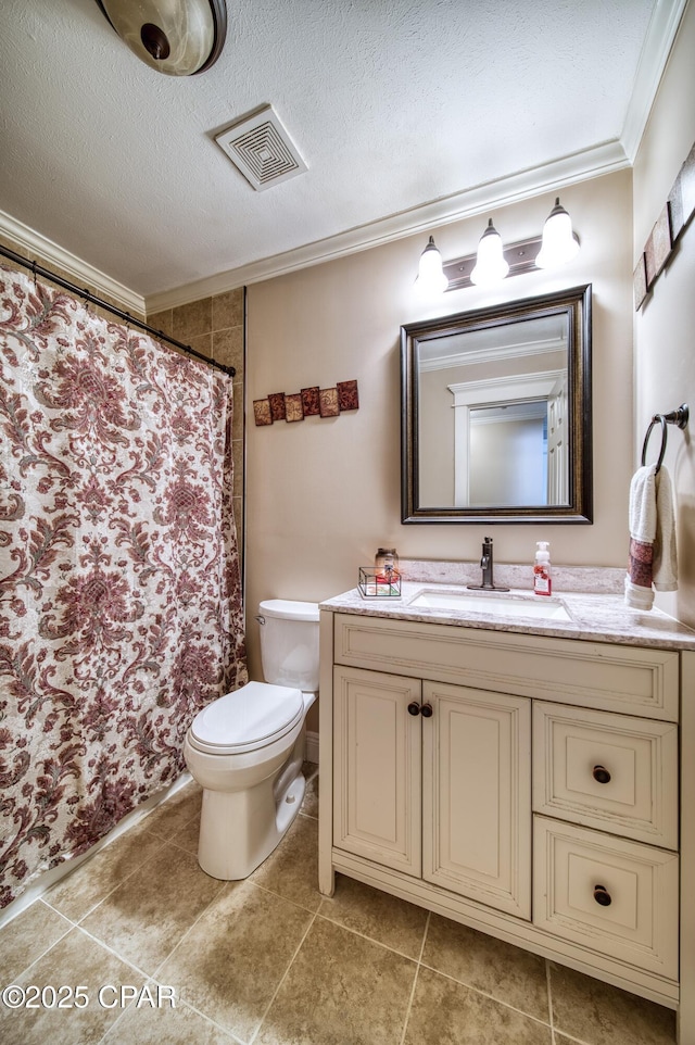 bathroom featuring ornamental molding, vanity, a textured ceiling, and toilet