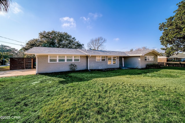 single story home with a front lawn, fence, and brick siding