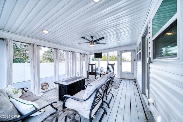 sunroom / solarium with ceiling fan