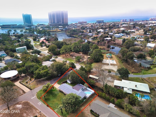 birds eye view of property featuring a water view