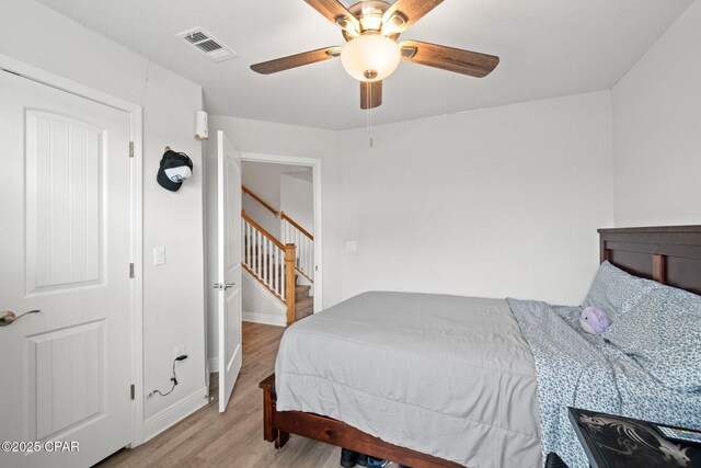 4701 Maegans Ridge Rd, Panama City, FL 32404 - bedroom with baseboards, ceiling fan, and wood finished floors