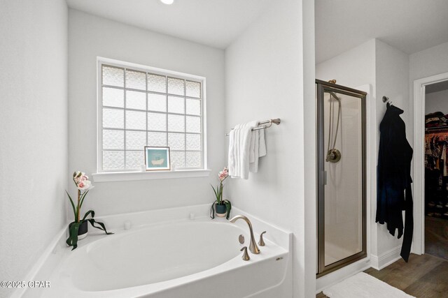 4701 Maegans Ridge Rd, Panama City, FL 32404 - full bathroom with a sink, double vanity, a shower stall, and wood finished floors