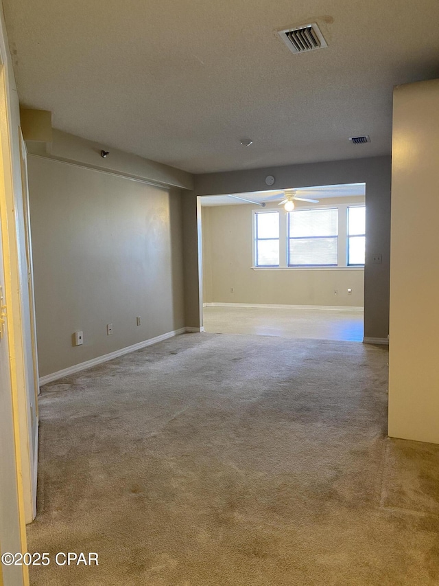 8730 Thomas Dr Unit 1209C, Panama City Beach, FL 32408 - carpeted empty room with ceiling fan and baseboards
