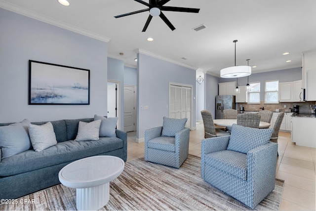 living room featuring recessed lighting, light tile patterned flooring, and crown molding