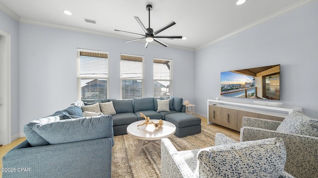 living room with recessed lighting, baseboards, visible vents, and ornamental molding