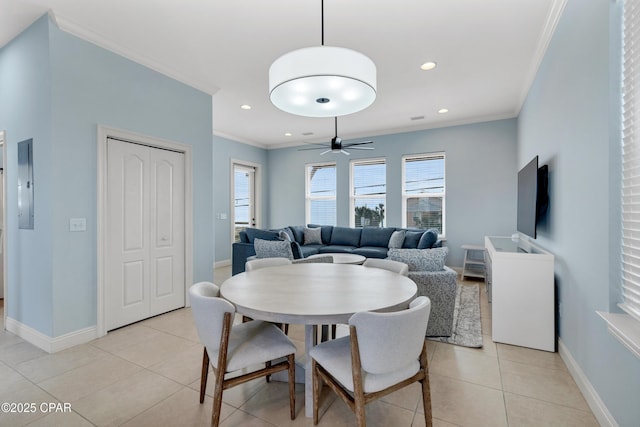 dining space with light tile patterned floors, recessed lighting, ornamental molding, a ceiling fan, and baseboards