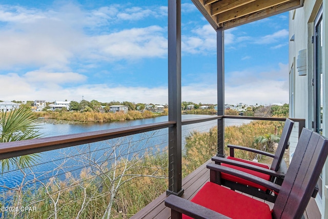 balcony featuring a water view