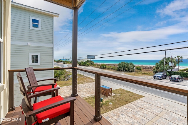 balcony with a beach view and a water view