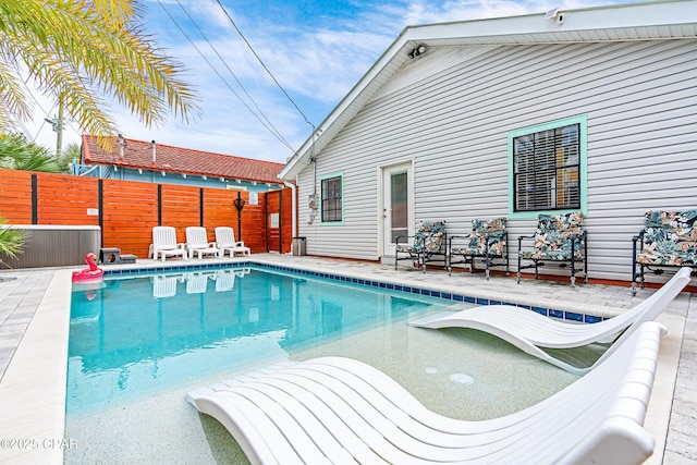 view of pool featuring fence