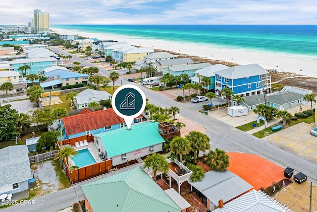 bird's eye view featuring a water view and a view of the beach