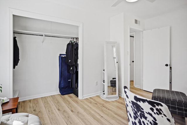 bedroom featuring light hardwood / wood-style floors and a closet