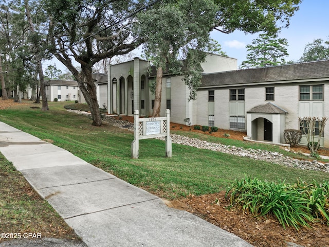 exterior space featuring a front lawn