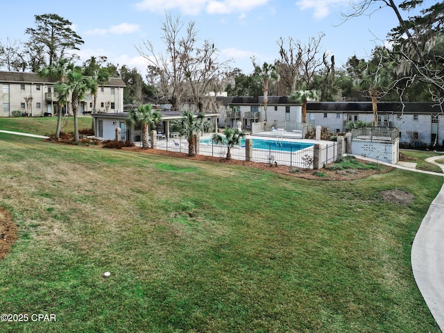 view of yard featuring a community pool