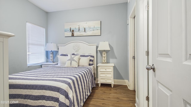 bedroom featuring dark hardwood / wood-style floors