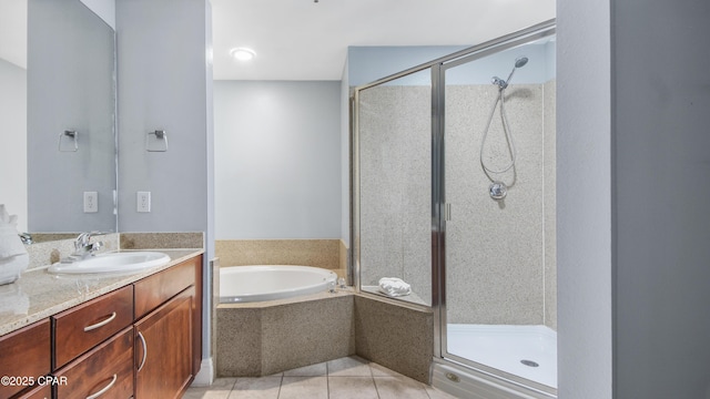 bathroom featuring tile patterned flooring, vanity, and plus walk in shower