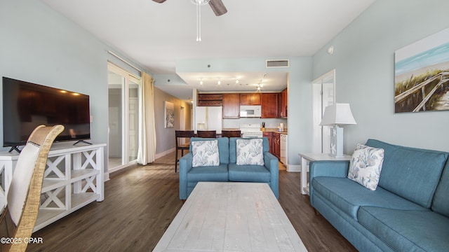 living room featuring dark hardwood / wood-style floors and ceiling fan