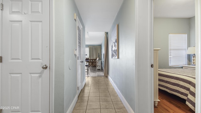 hallway featuring light tile patterned flooring