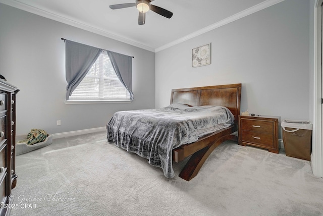 carpeted bedroom featuring ceiling fan and ornamental molding