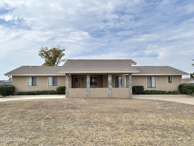 ranch-style house with stucco siding