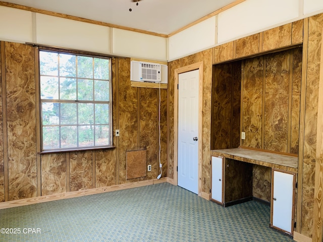 spare room featuring carpet and a wall mounted AC