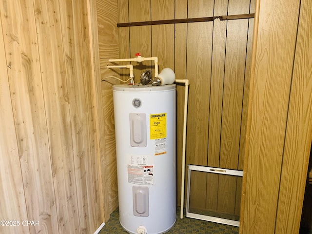 utility room featuring electric water heater