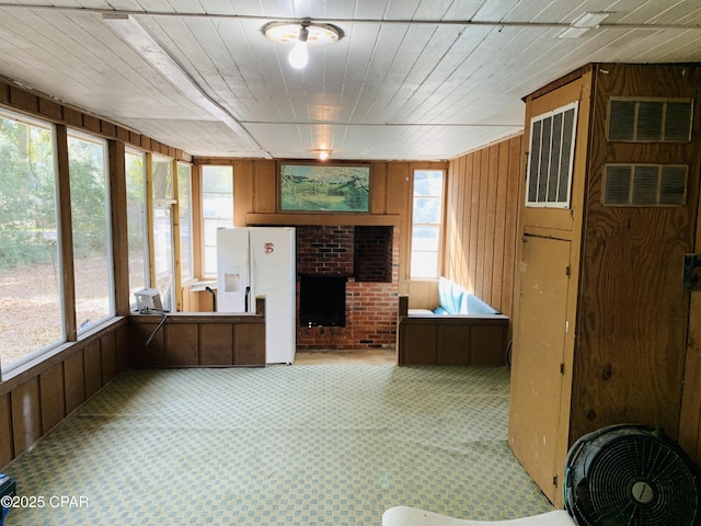 unfurnished sunroom featuring visible vents