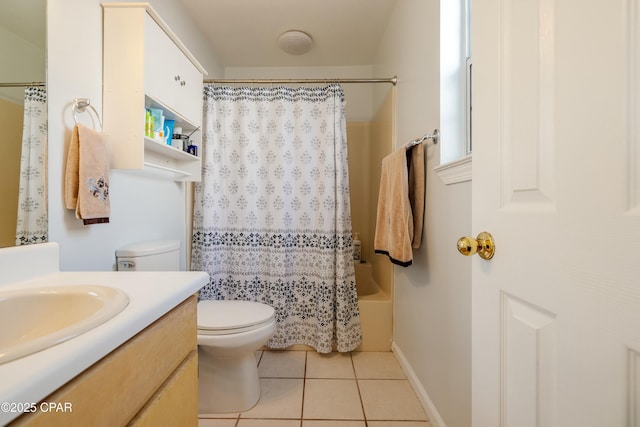 bathroom featuring toilet, shower / bath combo, tile patterned flooring, baseboards, and vanity