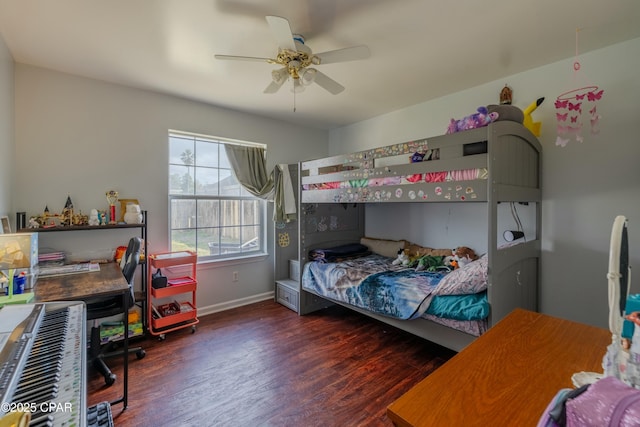 bedroom with a ceiling fan, wood finished floors, and baseboards