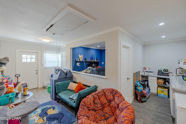 recreation room with recessed lighting, attic access, crown molding, and wood finished floors