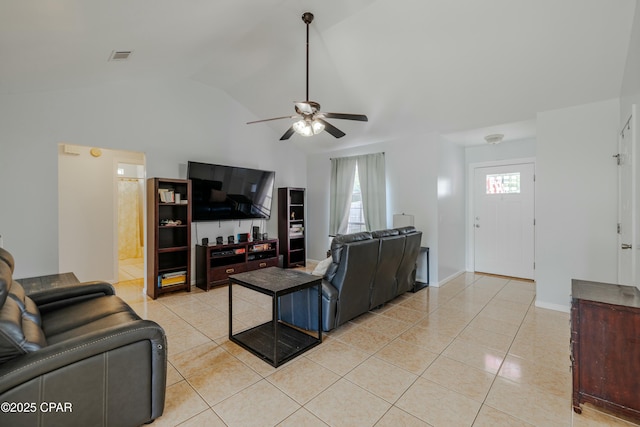 living area with visible vents, baseboards, vaulted ceiling, light tile patterned flooring, and a ceiling fan