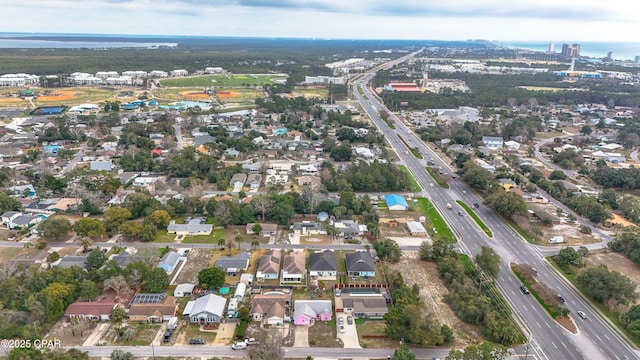 birds eye view of property with a residential view and a water view