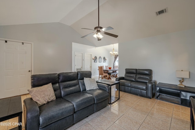 living room featuring vaulted ceiling, light tile patterned flooring, ceiling fan with notable chandelier, and visible vents