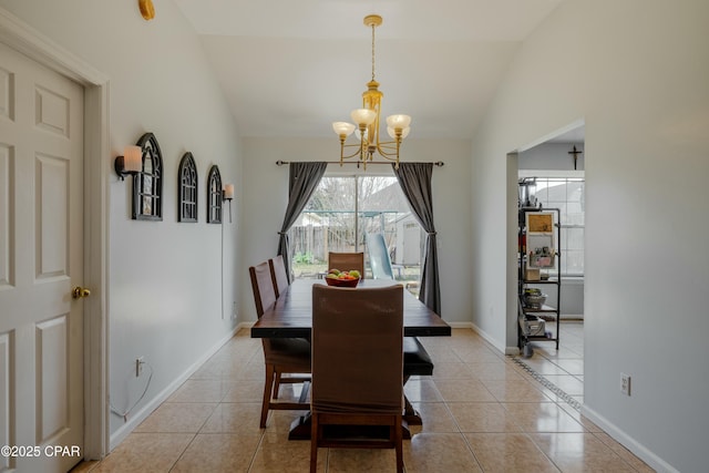 dining space featuring baseboards, lofted ceiling, a notable chandelier, and light tile patterned flooring