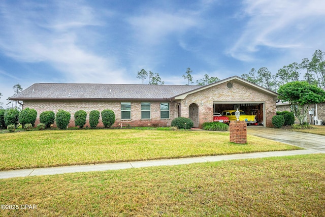 ranch-style house with a garage and a front yard