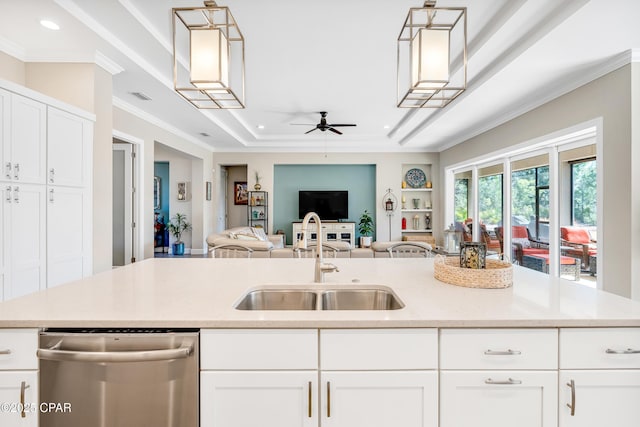 3507 Fox Run Blvd, Panama City Beach, FL 32408 - kitchen featuring dishwasher, a sink, open floor plan, a ceiling fan, and crown molding