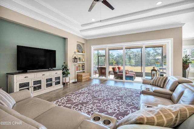 living area with recessed lighting, a healthy amount of sunlight, and wood finished floors