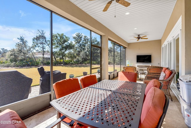 sunroom / solarium with ceiling fan