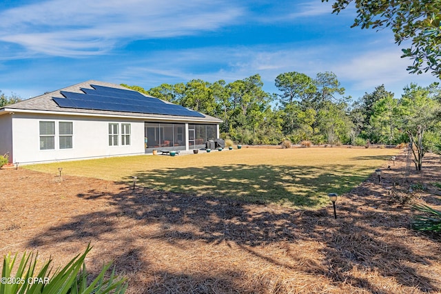 view of yard with a sunroom