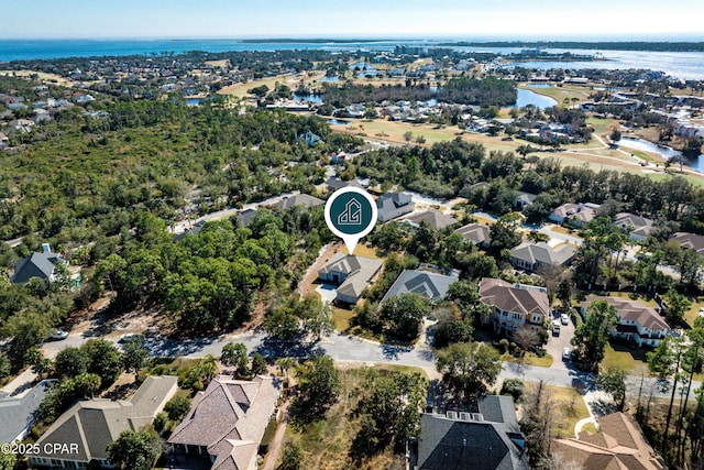 birds eye view of property featuring a residential view and a water view