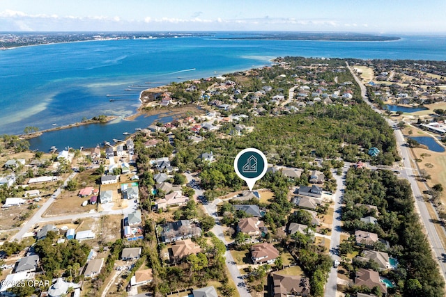 drone / aerial view with a water view and a residential view