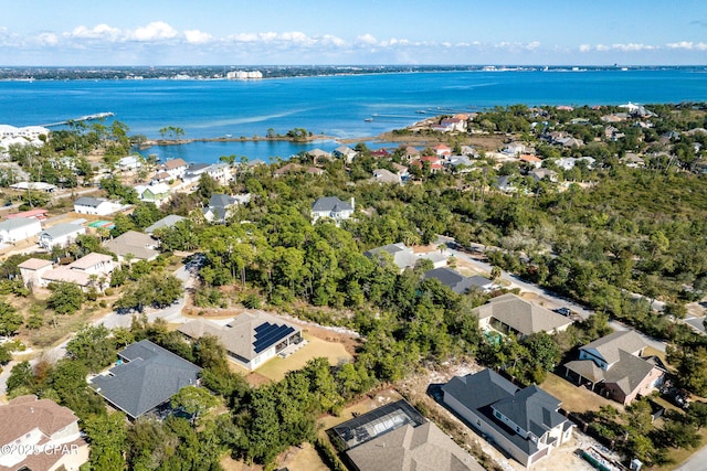 drone / aerial view featuring a water view and a residential view