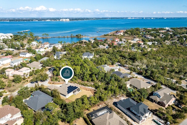 birds eye view of property featuring a water view and a residential view