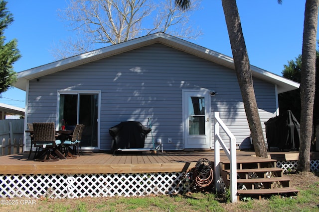 back of property featuring a wooden deck