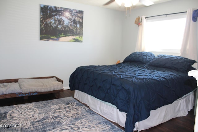 bedroom featuring a ceiling fan and wood finished floors