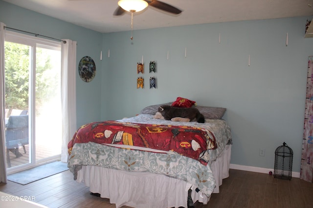 bedroom featuring a ceiling fan, access to outside, baseboards, and wood finished floors